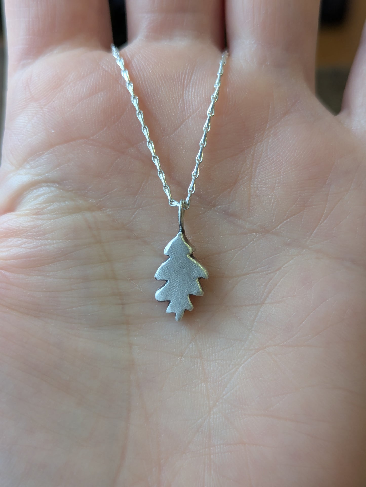 Small hand carved oak leaf pendant