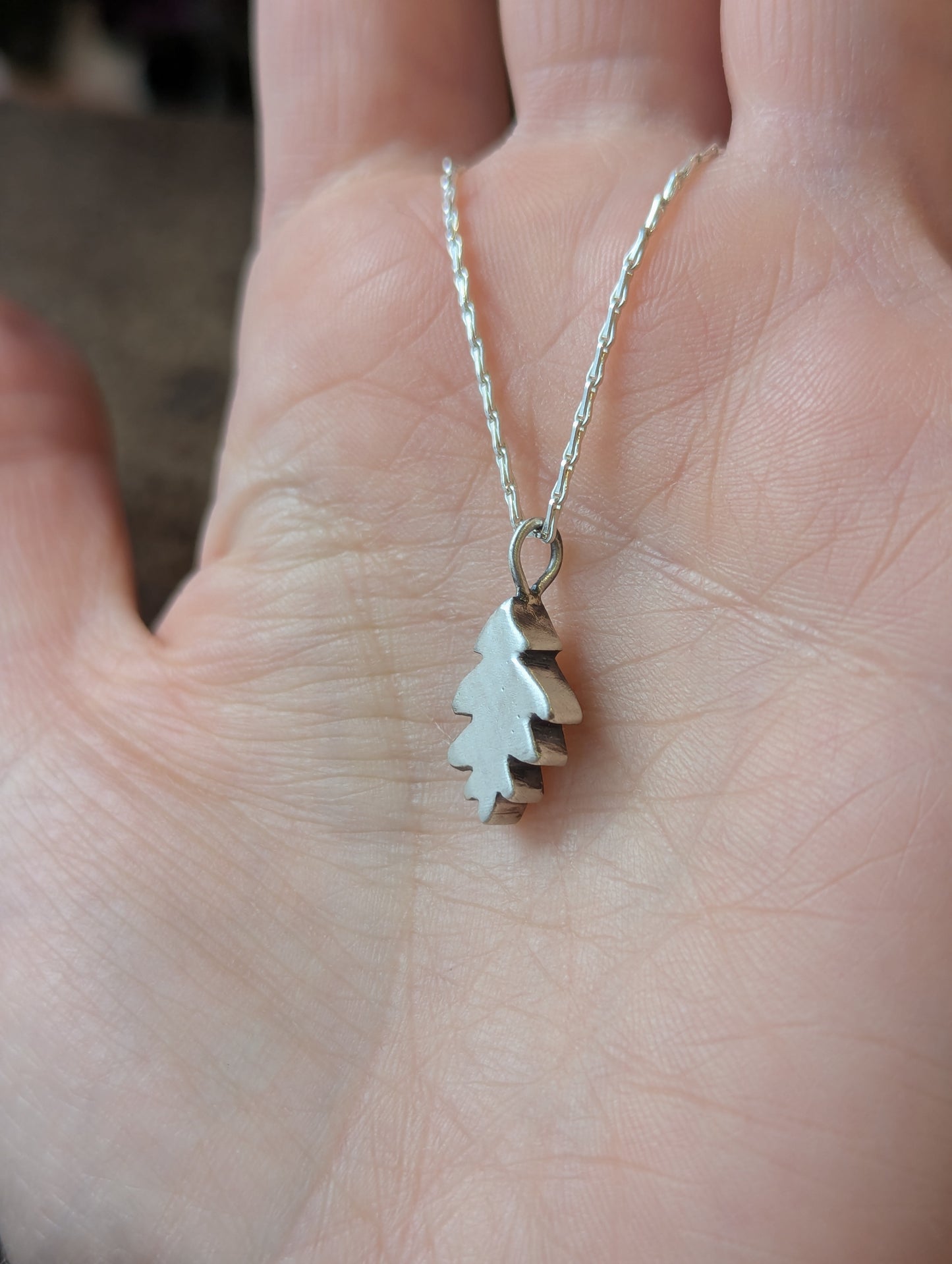 Small hand carved oak leaf pendant