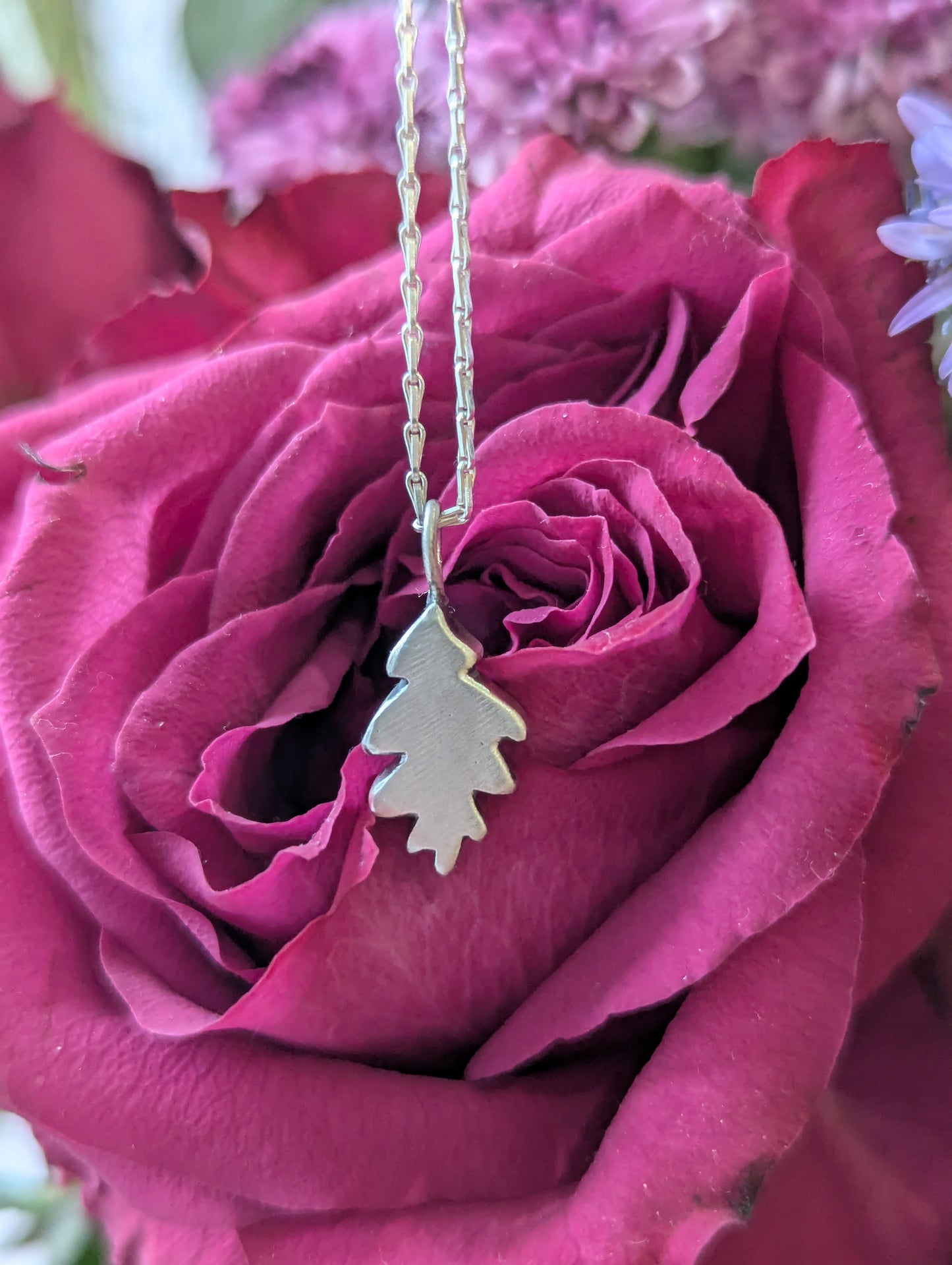 Small hand carved oak leaf pendant