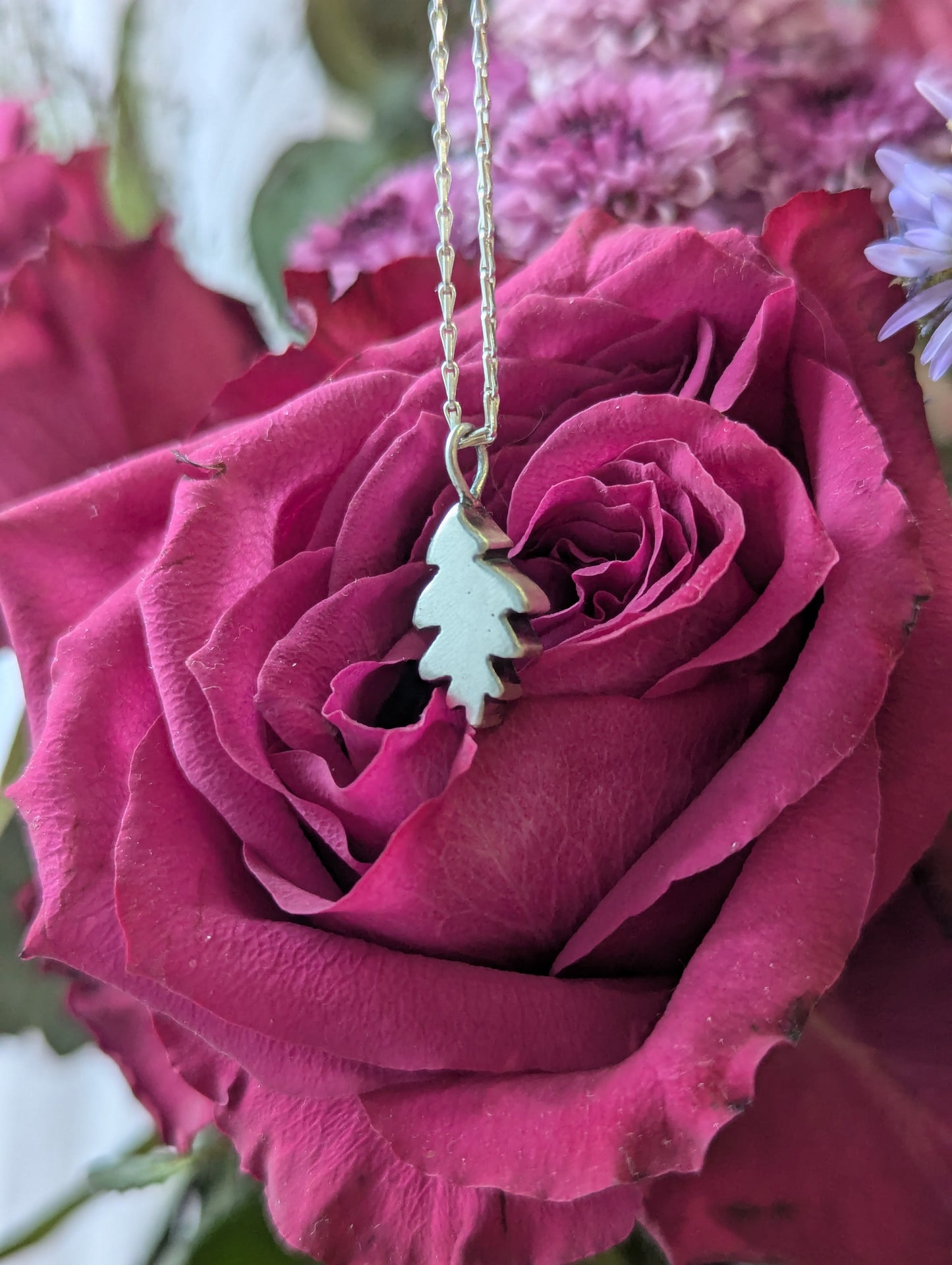 Small hand carved oak leaf pendant