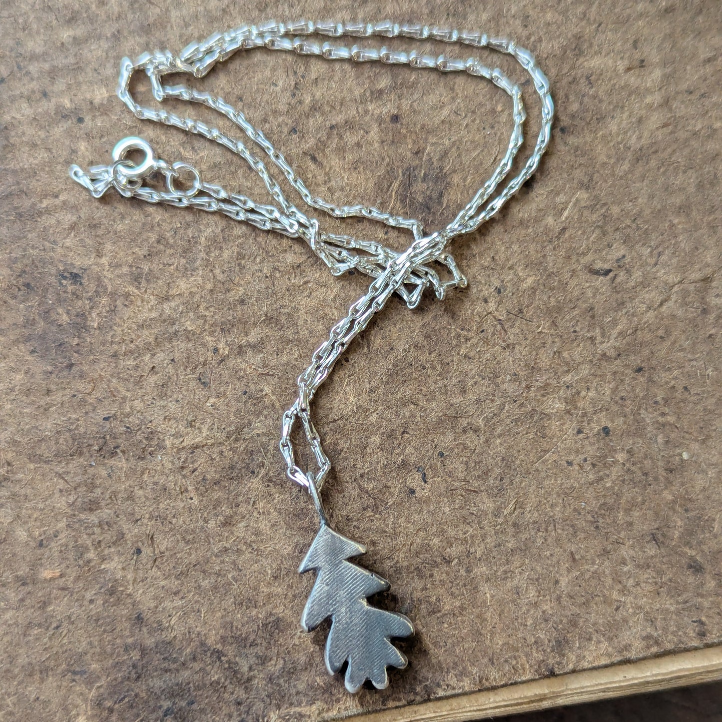 Hand carved oak leaf pendant