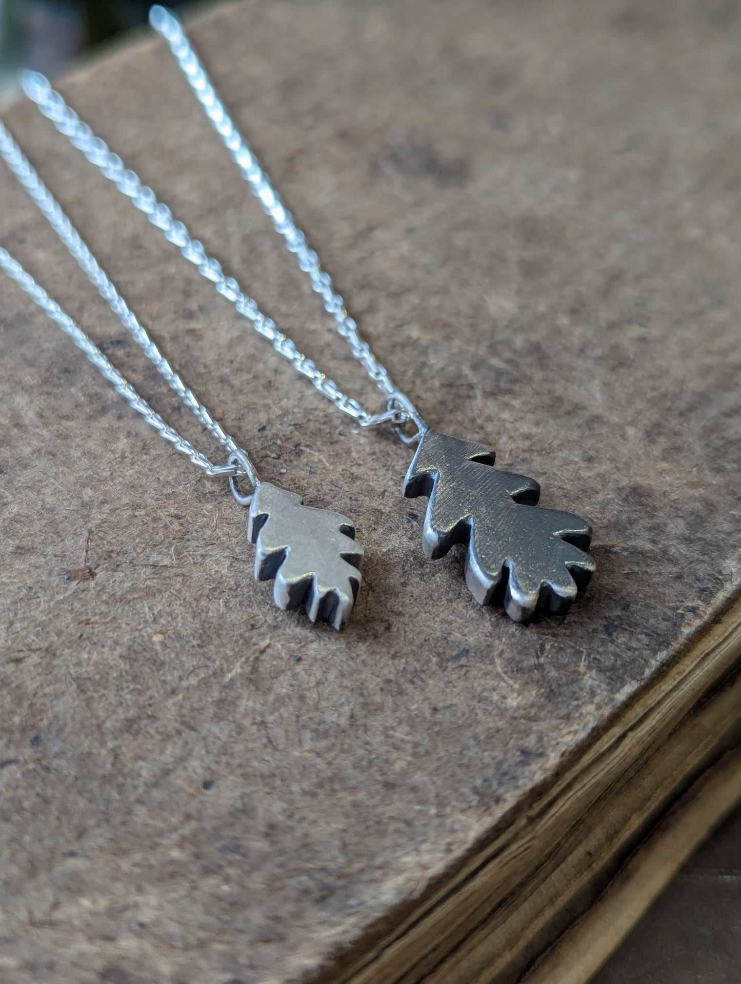 Small hand carved oak leaf pendant