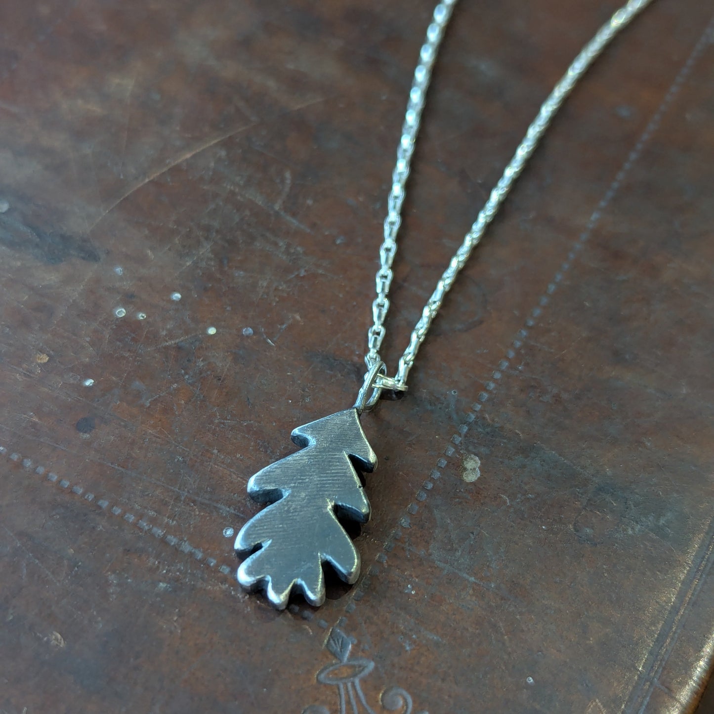 Hand carved oak leaf pendant